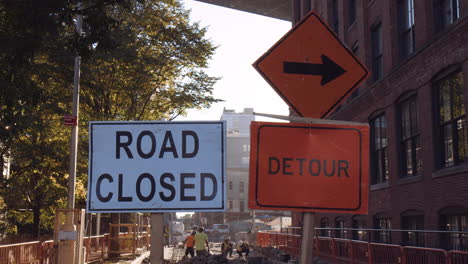 road closed and detour signs in streets of new york city, close up