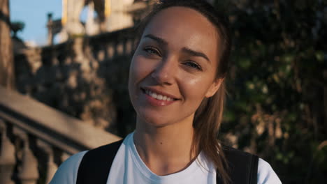 Camera-zooming-on-soccer-woman-smiling-at-camera-in-the-street.