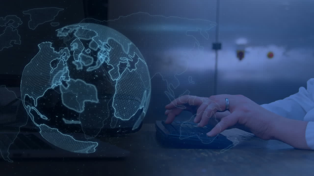 hombre escribiendo en el teclado y el globo digital