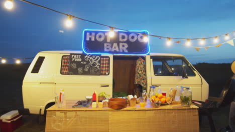 food truck with garland lights at night