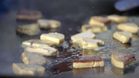 cooking foie gras on a stove in slow motion