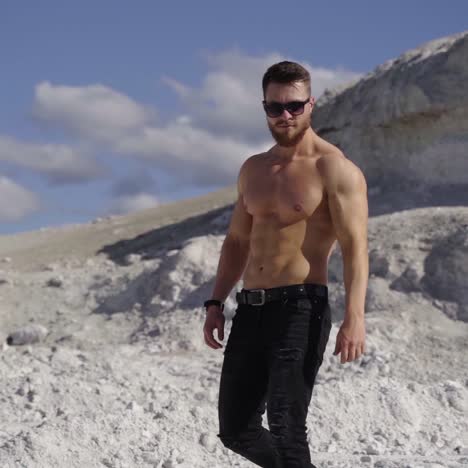 handsome fit man posing outdoors