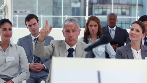 man intervening at a meeting