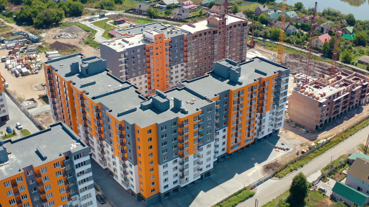 Multi-storey apartments in new area. Construction of a modern residential complex. Modern high rise architecture. Aerial view.