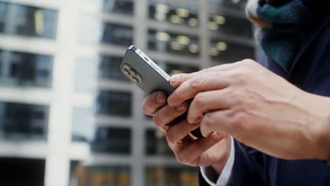 businessman using smartphone in city