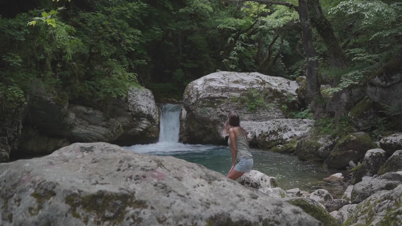 solo female hiker travels to Kouiassa Waterfalls for a relaxing day trip in the countryside of Greece