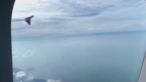 Beautiful-aerial-view-seen-through-window-of-flying-airplane