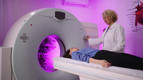 patient undergoing a medical scan assisted by a doctor