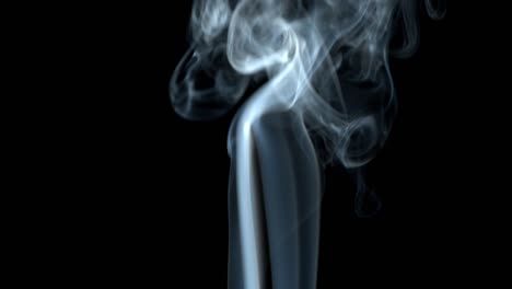 smoke on black background jet rises up. smoke dissipates.