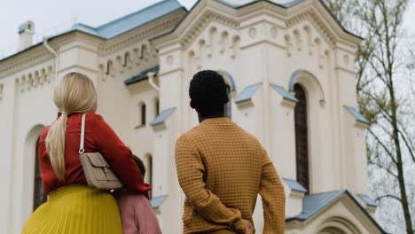 family outside the church