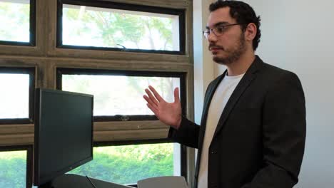 university professor explains data with tablet