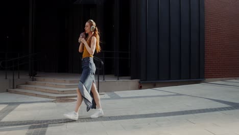 happy woman dancing on the street