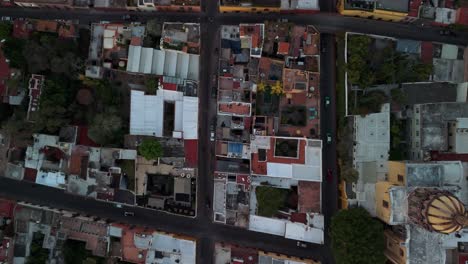 top down drone view over the top of mexican streets in san miguel de allende at sunrise