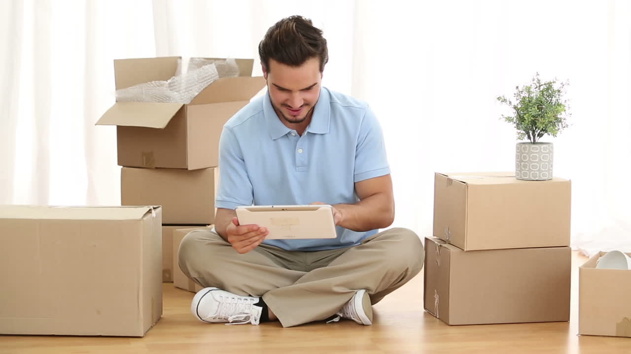 Man using digital tablet in his living room