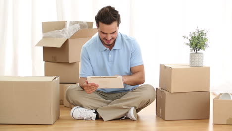 man using digital tablet in his living room