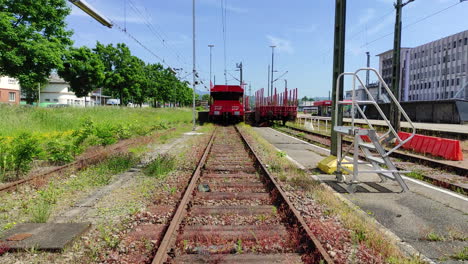 old locomotive on train tracks, zoom in shot.