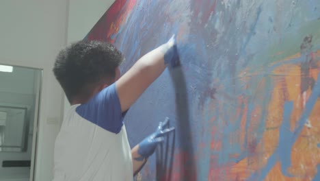 little boy using hands painting art picture