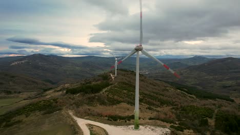 This-is-a-video-of-a-wind-farm-with-multiple-windmills,-filmed-near-San-Giovanni-Lipioni-in-Italy