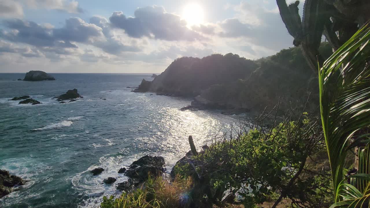 Waves crashing on a cliff in Zipolite, Mexico
