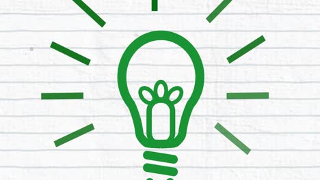 animation of green light bulb on lined paper background