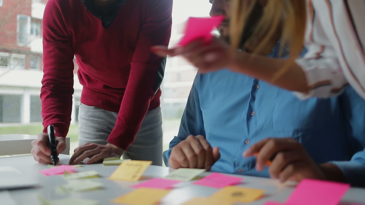 Young people working over new project together.