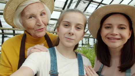 happy family selfie in a greenhouse