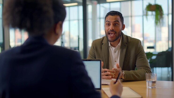 Confident Man Discussing Project During Job Interview in Modern Office
