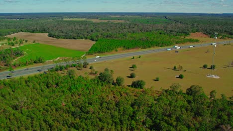 Semi-trucks-and-trailers-exiting-truck-stop-from-Jasper,-Florida,-USA