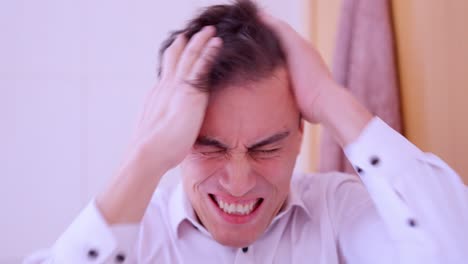 insecure man combing hair before a date
