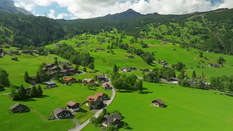 aerial view over the summer country side and eiger express in grindelwald, switzerland