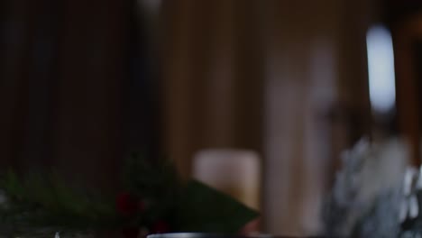 an african american's hand picking up two traditional holiday drinks christmas eggnog