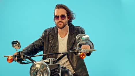 Motorbike,-fashion-and-man-in-studio-on-blue