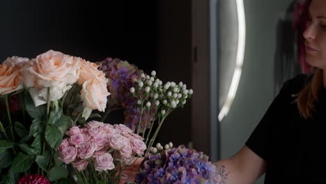 woman arranging beautiful flowers