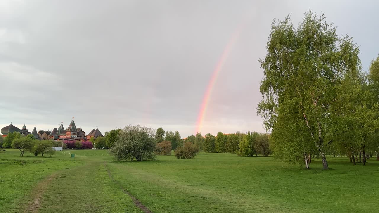 Rainbow after rain over an ancient wooden palace 1 (4K 60fps, in motion)