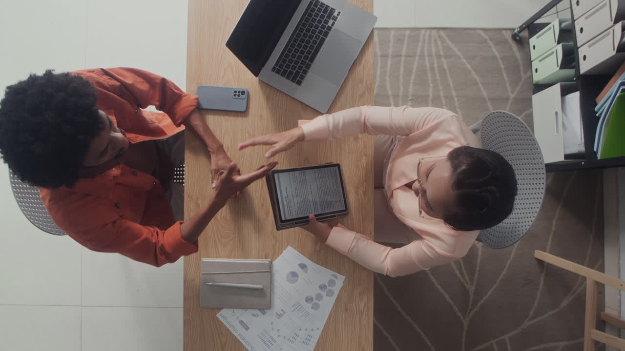 Head of Company Interviewing Candidate at Office Desk