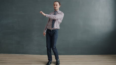 man dancing in business casual outfit