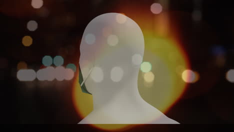 human head model wearing face mask spinning against night city traffic