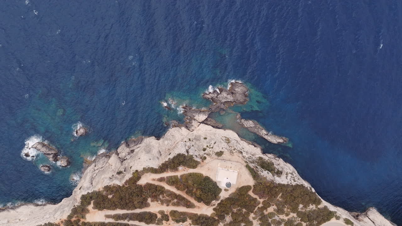 Aerial View of Coastal Cliffs and Lighthouse