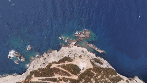 aerial view of coastal cliffs and lighthouse