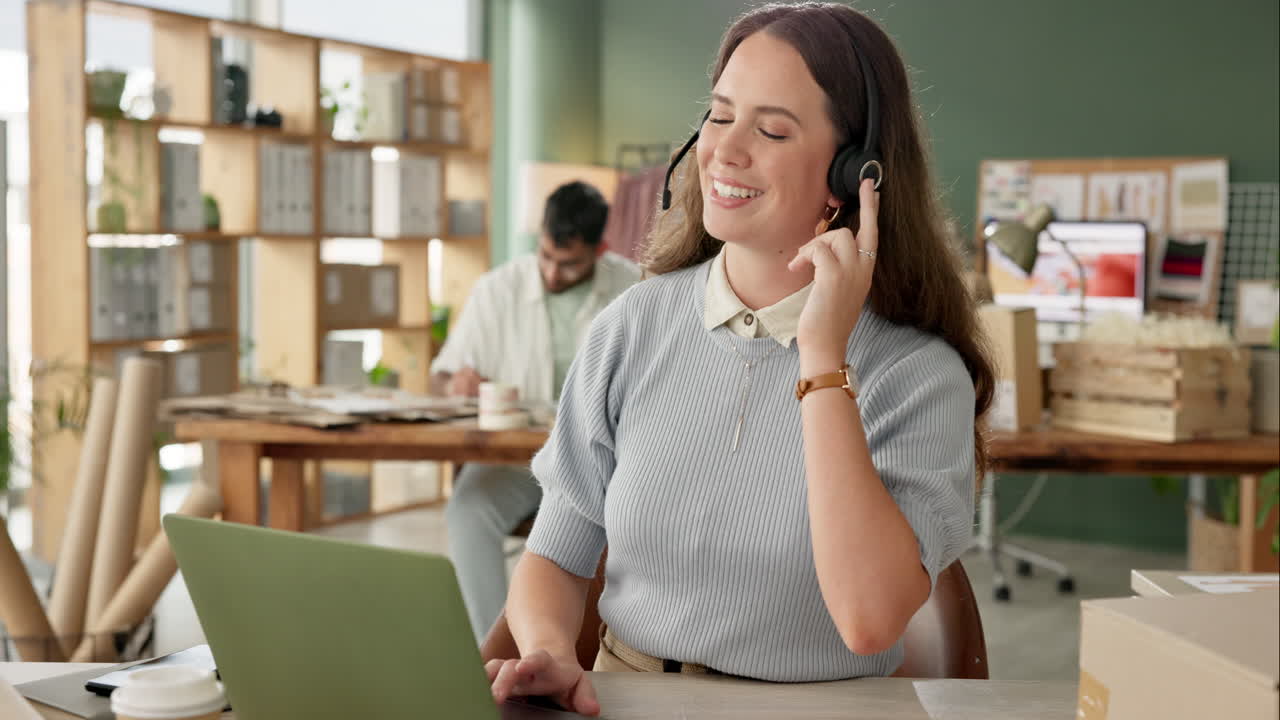 Woman working in call center with headset and laptop