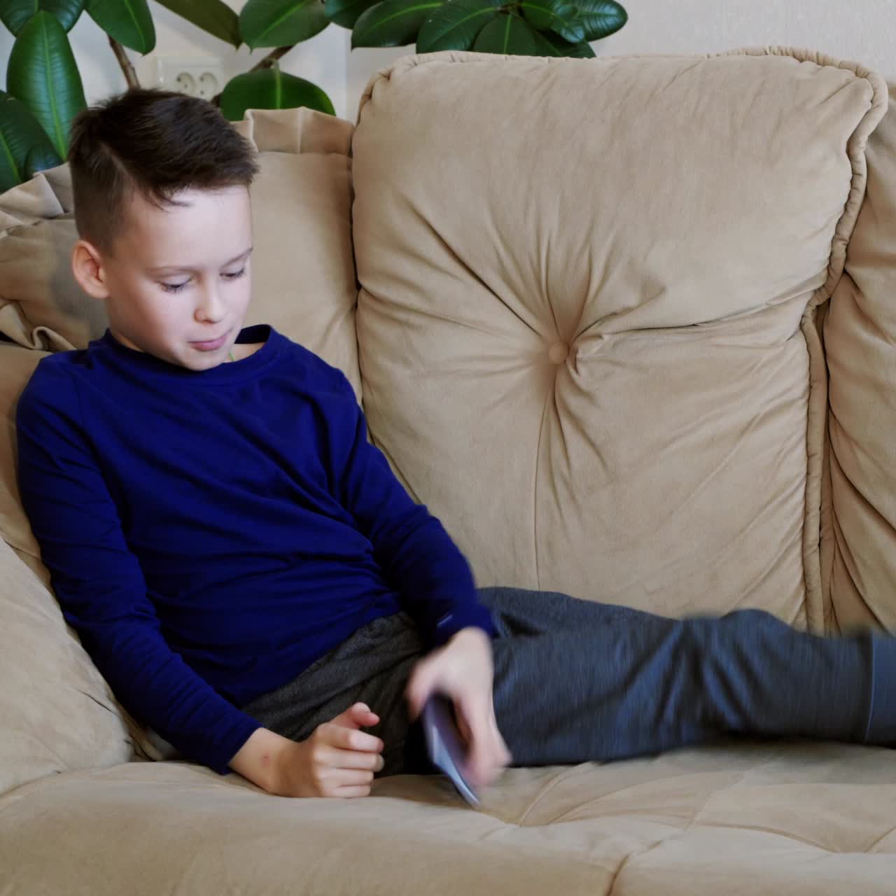 Child playing on smart phone