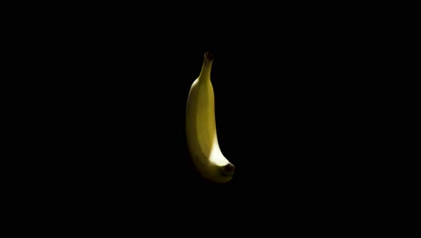 Banana-spinning-in-mid-air-with-black-background