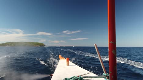 rear passenger view on travel boat leaving island