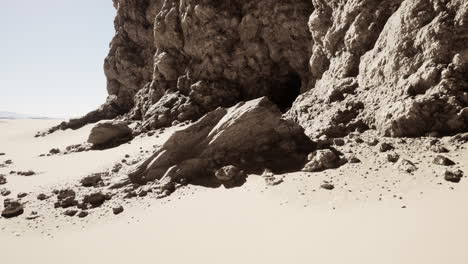 desert landscape with rocks and a cave