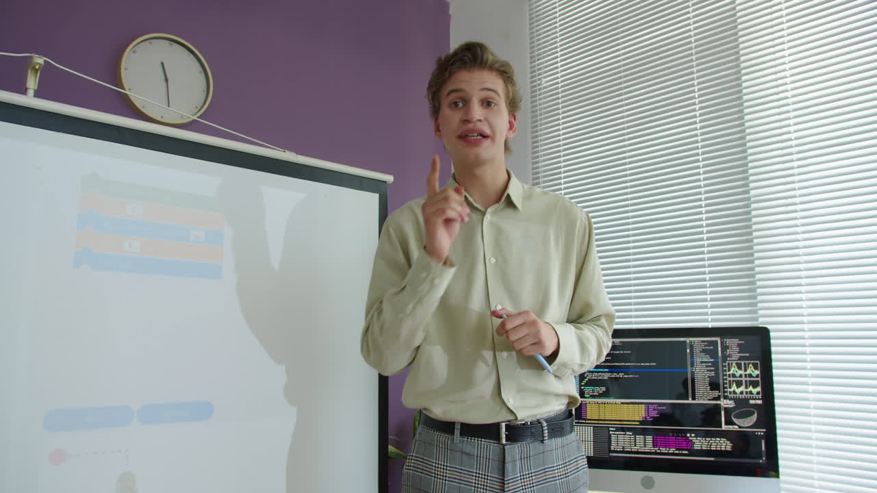 Young Teacher Giving Lesson on Computer Science