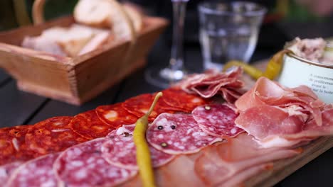 assorted meats and bread on a table