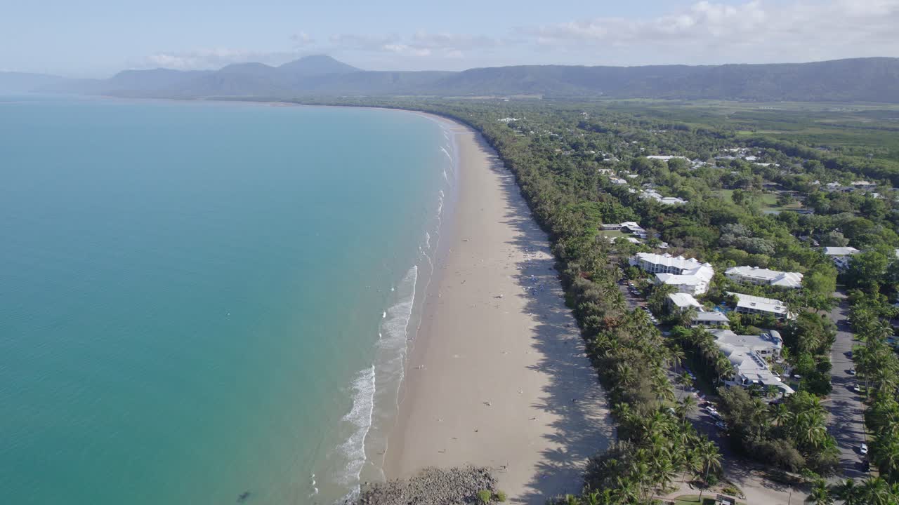 Aerial View Of Four Mile Beach With Turquoise Ocean Water And Tropical Vegetation In Port Douglas, Queensland, Australia - drone shot