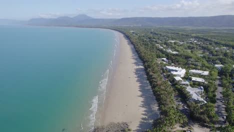 Aerial-View-Of-Four-Mile-Beach-With-Turquoise-Ocean-Water-And-Tropical-Vegetation-In-Port-Douglas,-Queensland,-Australia---drone-shot