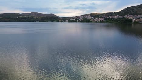 exploring the mesmerizing beauty of kastoria: a sunny day aerial journey over the city and lake