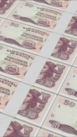 vertical video of 50 bolivian boliviano banknotes printed by a money press